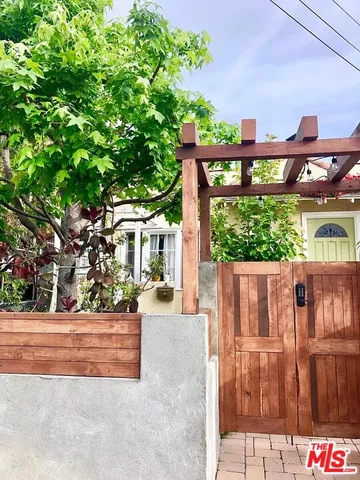a view of a backyard with sitting area