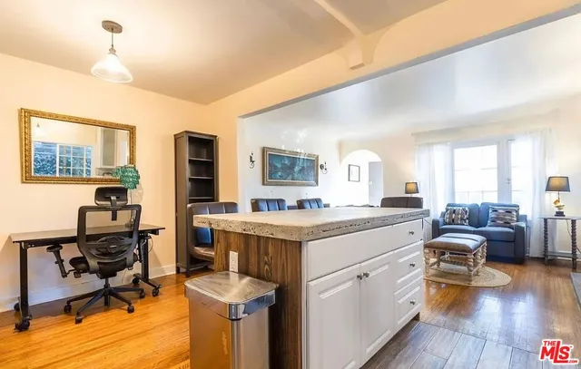 a view of living room with furniture and wooden floor
