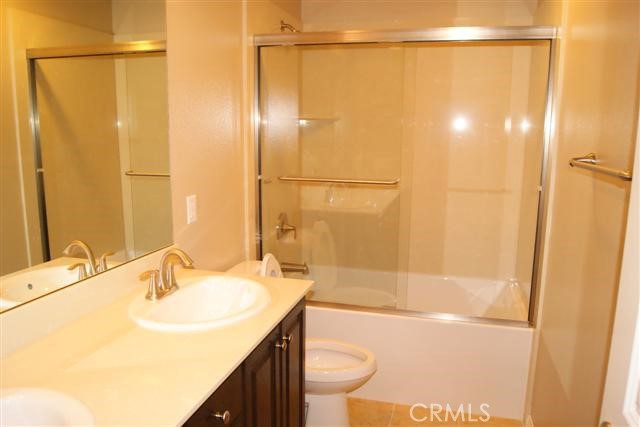 23 Keepsake Irvine, CA 92618 - Photo 16 of 18 a bathroom with a sink a toilet and shower