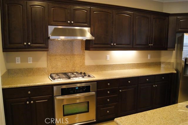 23 Keepsake Irvine, CA 92618 - Photo 7 of 18 a kitchen with a stove and a microwave
