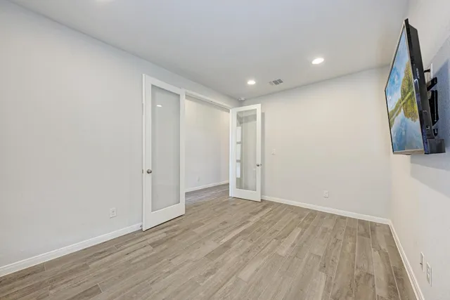 a view of hallway with wooden floor