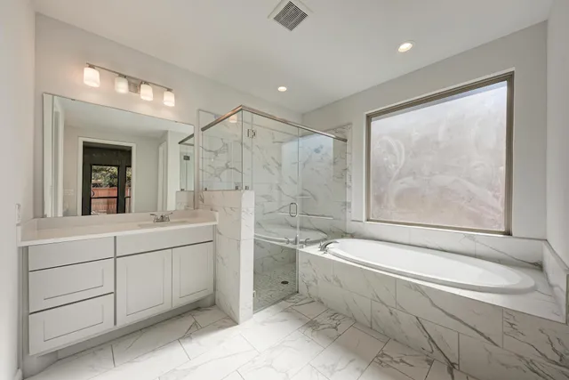 a bathroom with a toilet a sink and bathtub