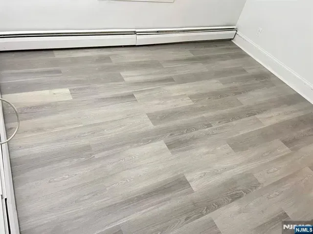 a view of a kitchen with microwave and a sink
