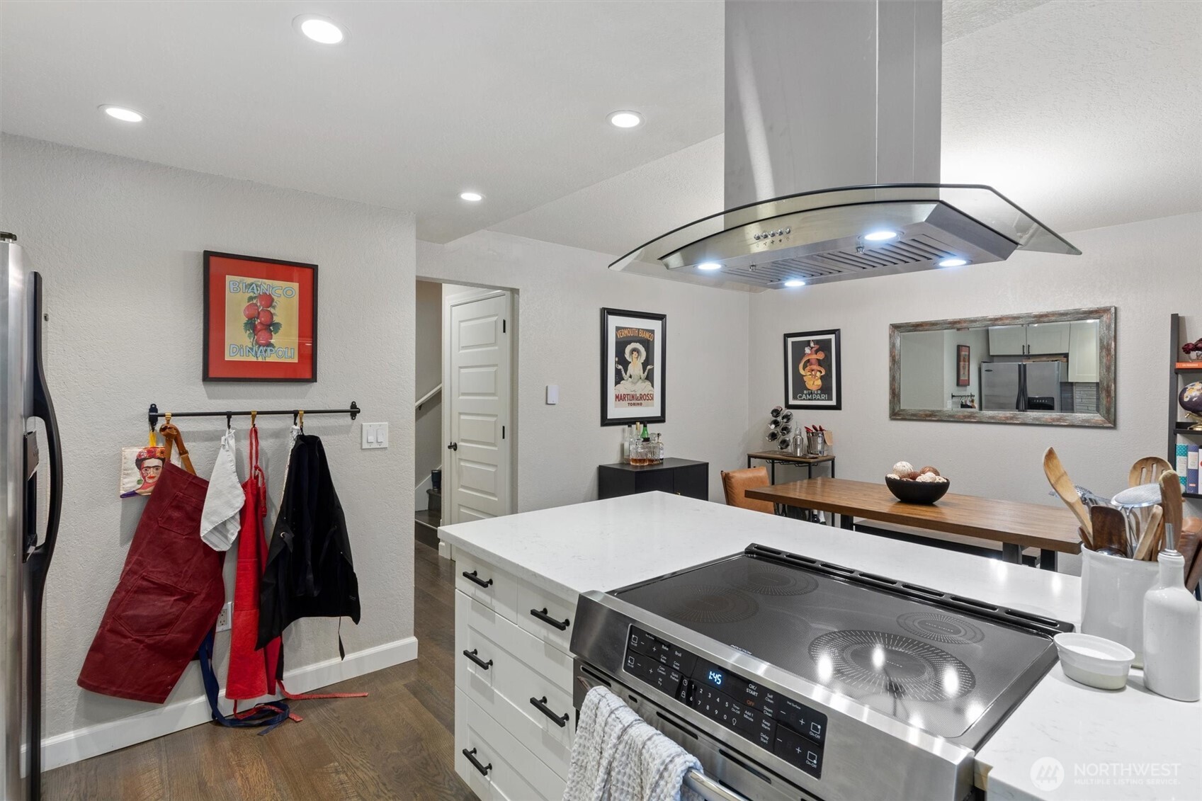 8515 Main Street, Unit 103 Edmonds, WA 98026 - Photo 11 of 34 a living room with lots of furniture and air hockey table