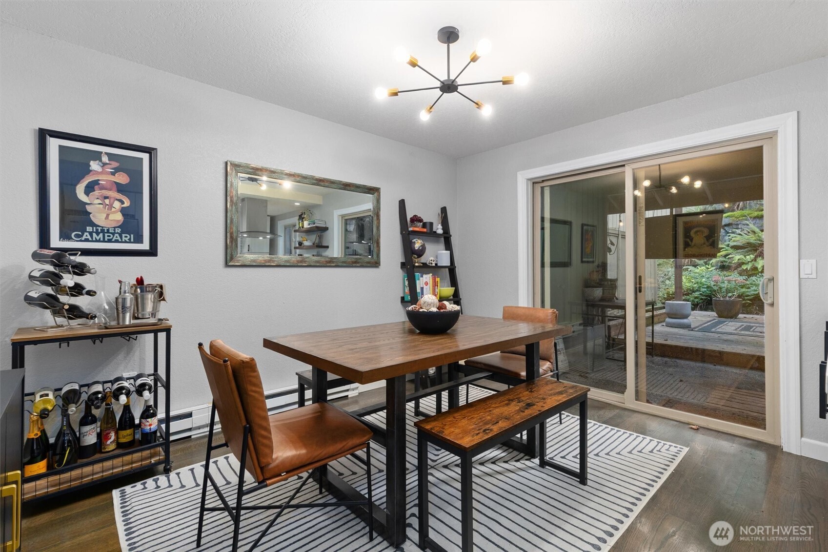 8515 Main Street, Unit 103 Edmonds, WA 98026 - Photo 13 of 34 a view of a dining room with furniture window and wooden floor