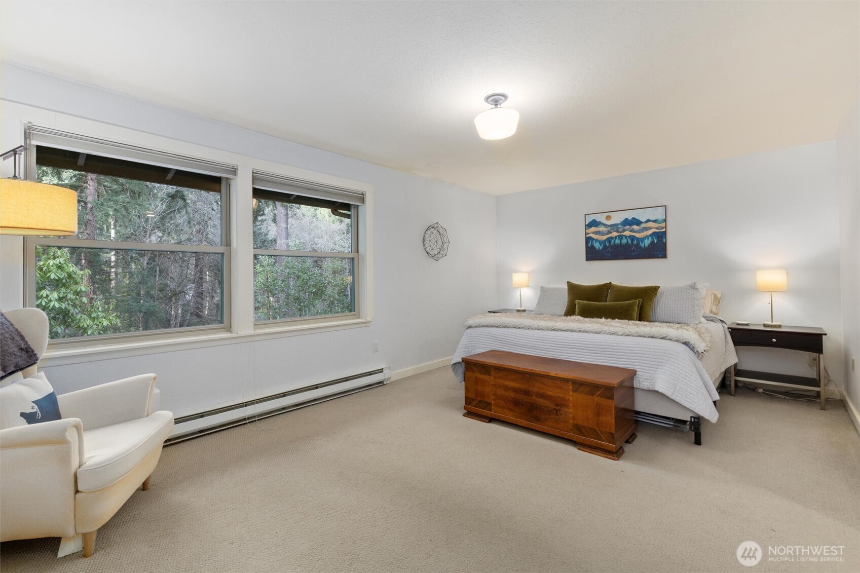 8515 Main Street, Unit 103 Edmonds, WA 98026 - Photo 18 of 34 a bedroom with a bed and a large window