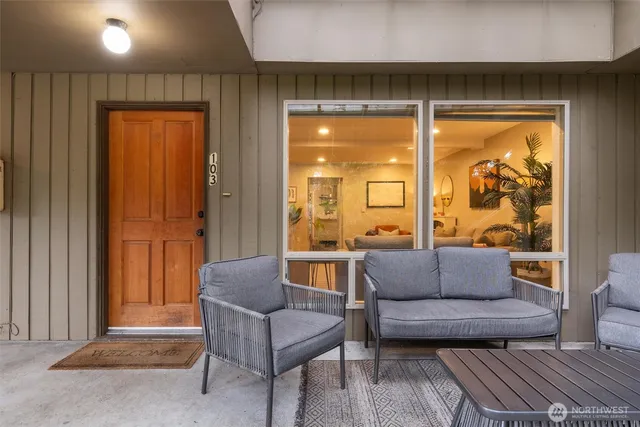 a living room with furniture and a large window