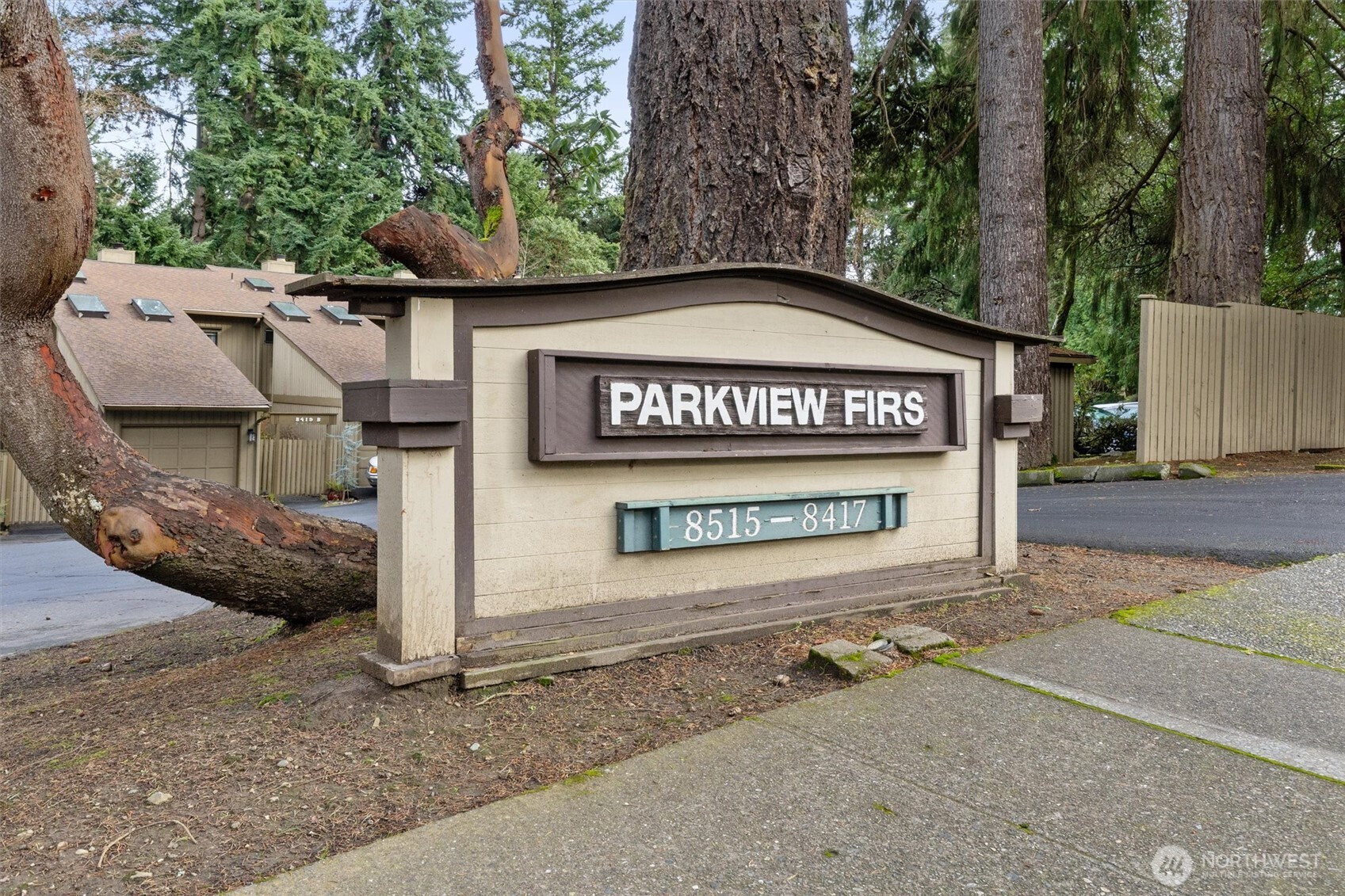 8515 Main Street, Unit 103 Edmonds, WA 98026 - Photo 24 of 34 a sign on the side of a road