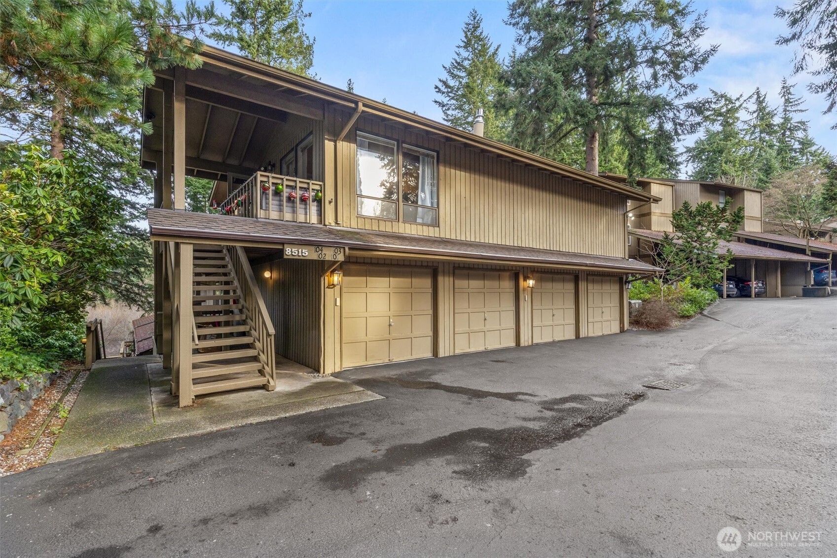 8515 Main Street, Unit 103 Edmonds, WA 98026 - Photo 25 of 34 a front view of a house with a yard