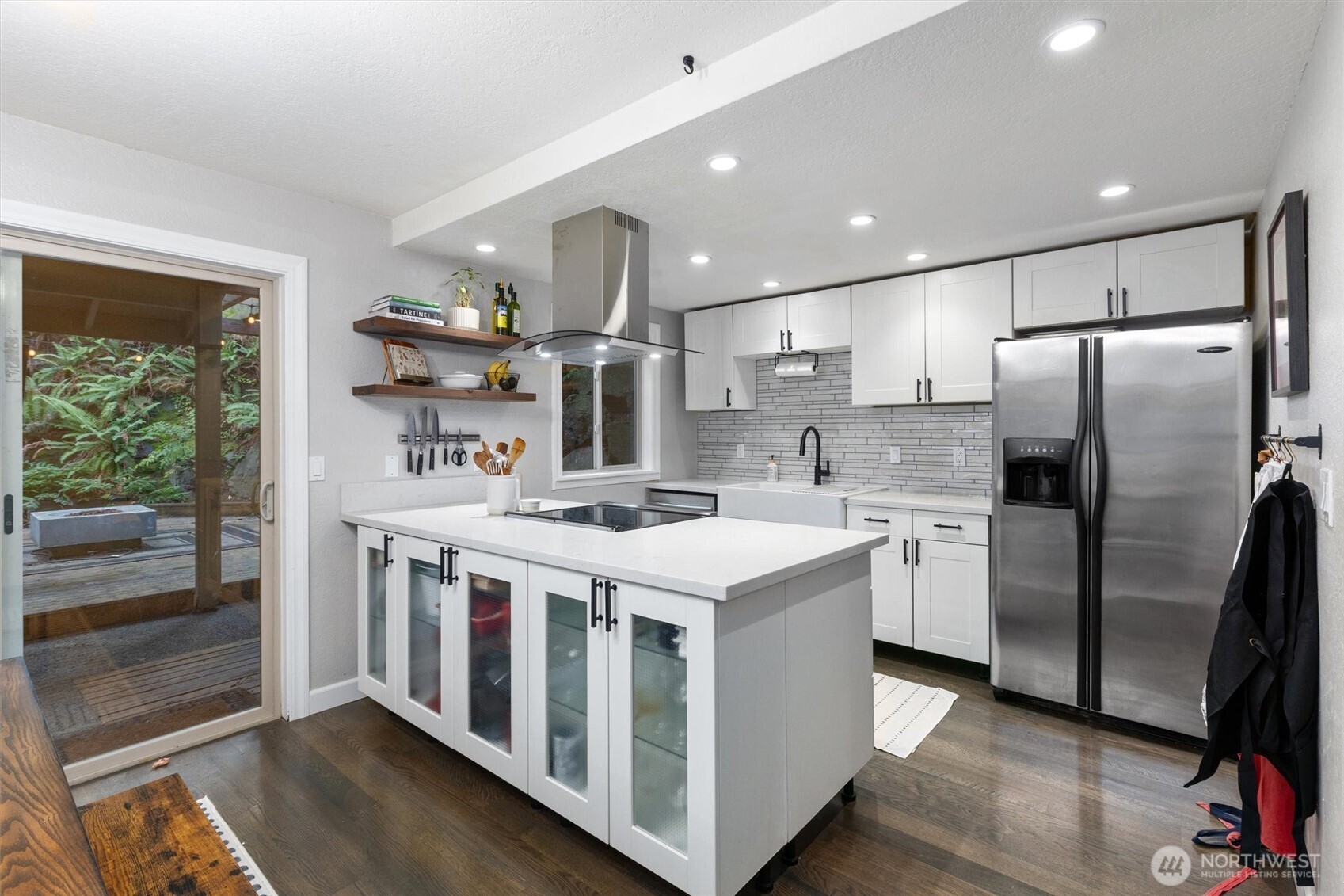 8515 Main Street, Unit 103 Edmonds, WA 98026 - Photo 7 of 34 a kitchen with stainless steel appliances a white stove top oven and a refrigerator