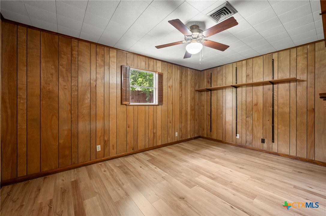 201 Hillcrest Drive Luling, TX 78648 - Photo 12 of 26 a view of an empty room with a window