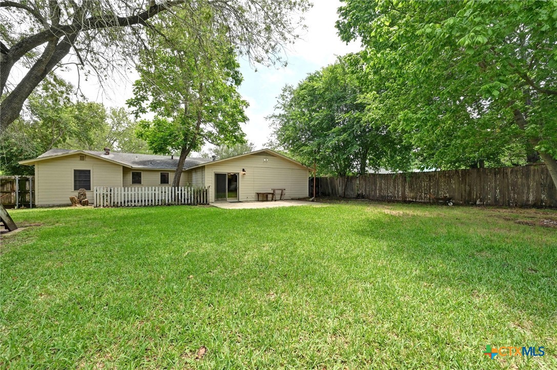 201 Hillcrest Drive Luling, TX 78648 - Photo 22 of 26 a view of a house with a backyard