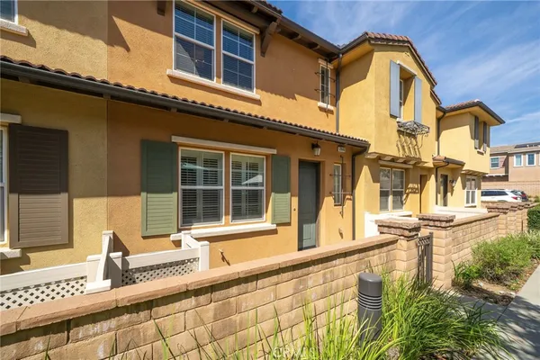 a front view of a house with a swimming pool