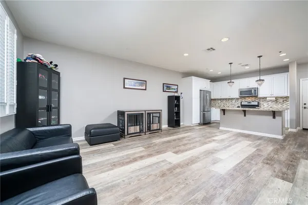 a spacious bedroom with a bed and a couch