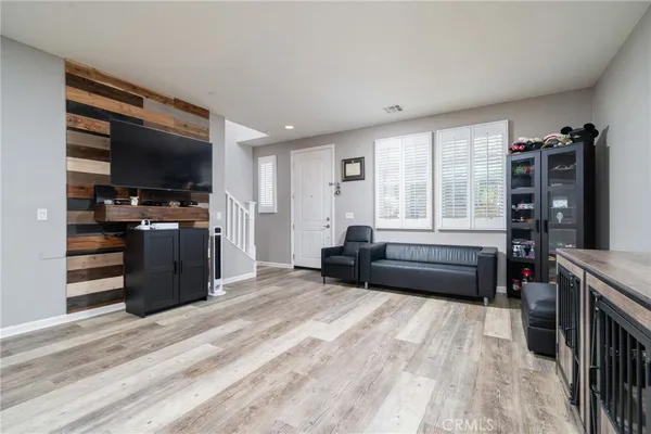 a kitchen with kitchen island a sink stainless steel appliances and cabinets