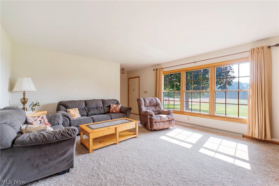 8360 Roller Road Salem, OH 44460 - Photo 14 of 45 Expansive triple-pane window unit with wood trim, offering abundant natural light and an exterior landscape