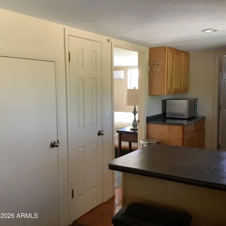a kitchen with a refrigerator and a sink