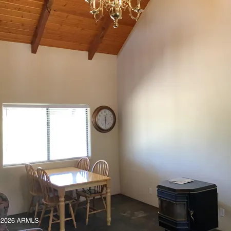 a room with a table and chairs