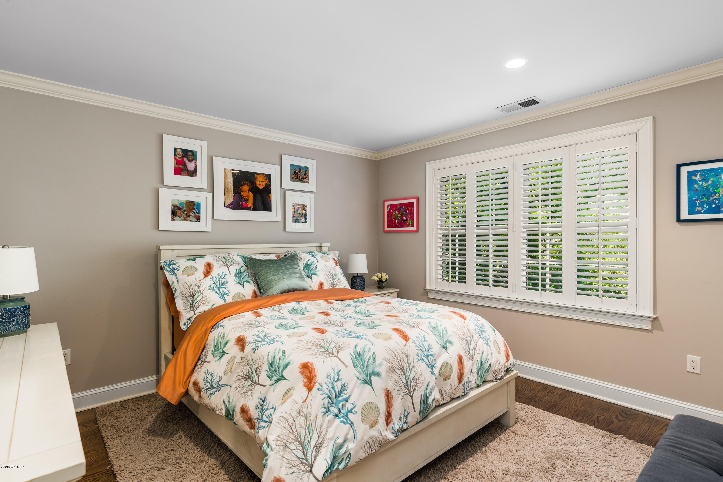 8 Plow Lane Greenwich, CT 06830 - Photo 16 of 24 a bedroom with a bed and a window