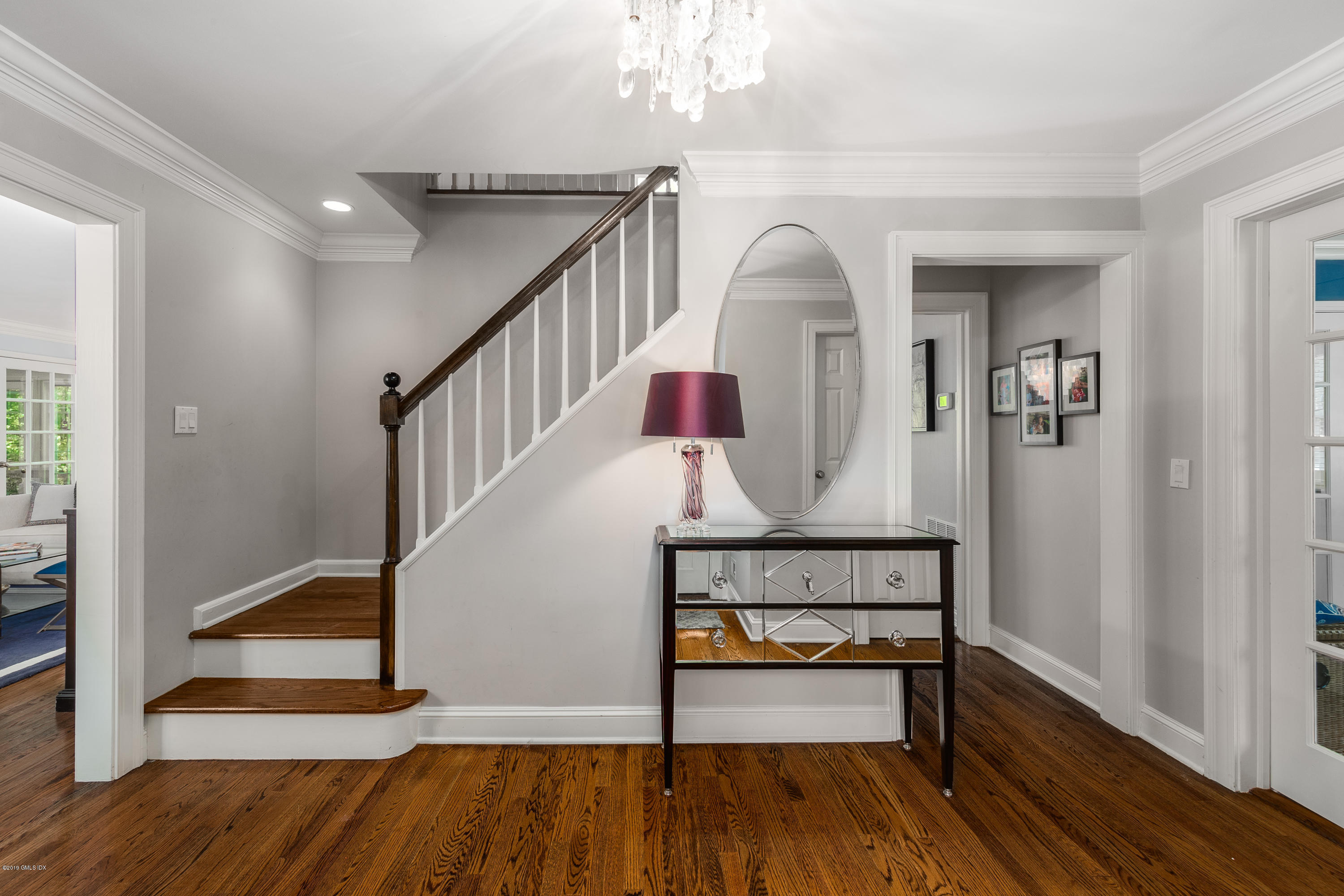 8 Plow Lane Greenwich, CT 06830 - Photo 3 of 24 a view of entryway with wooden floor and stairs