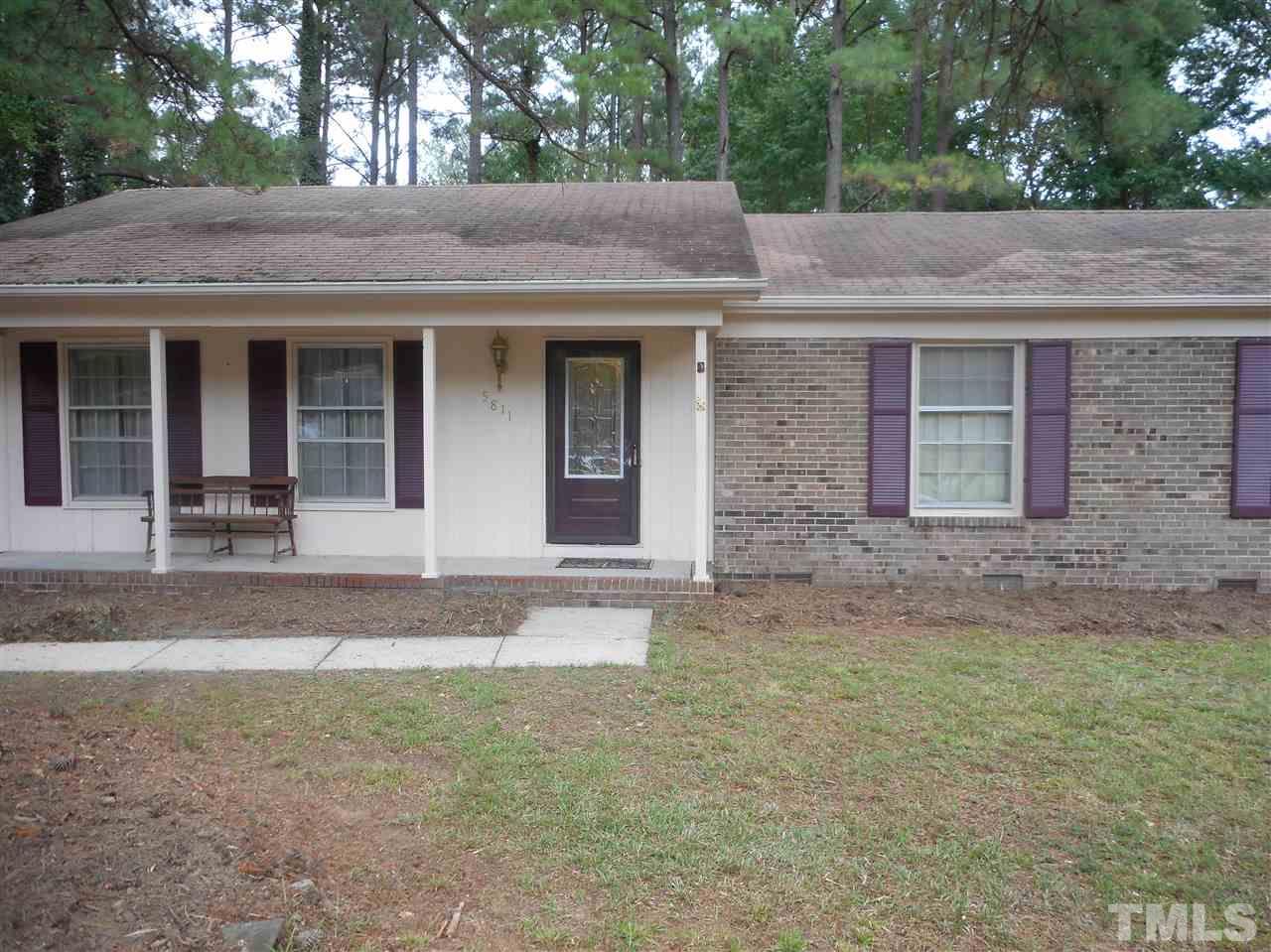 5811 Newhall Road Durham, NC 27713 - Photo 1 of 6 a view of a house with a yard and large tree