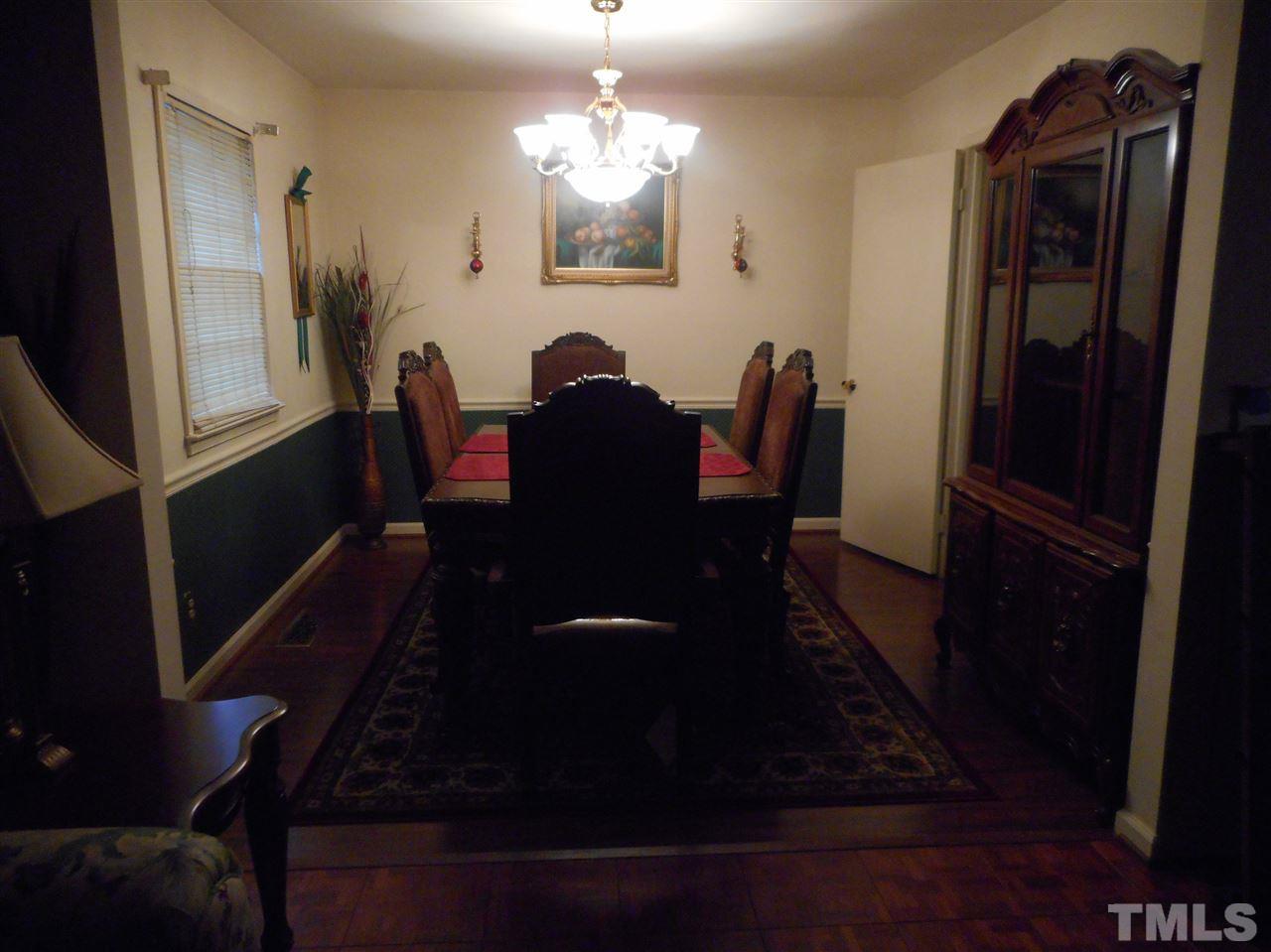 5811 Newhall Road Durham, NC 27713 - Photo 3 of 6 a view of a dining room with furniture