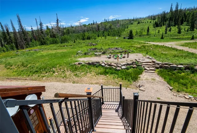 a view of a wooden fence and a yard