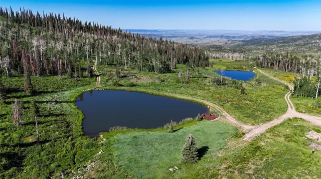 an aerial view of a house with yard