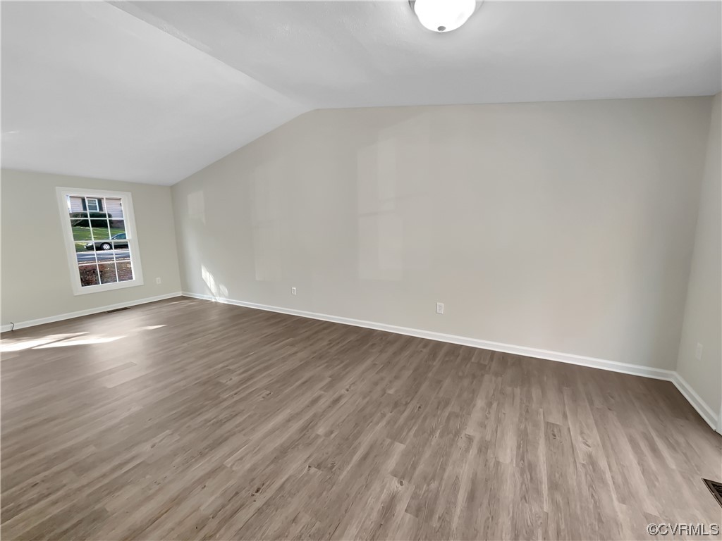 1125 Oldbury Road Midlothian, VA 23113 - Photo 3 of 17 an empty room with wooden floor and windows