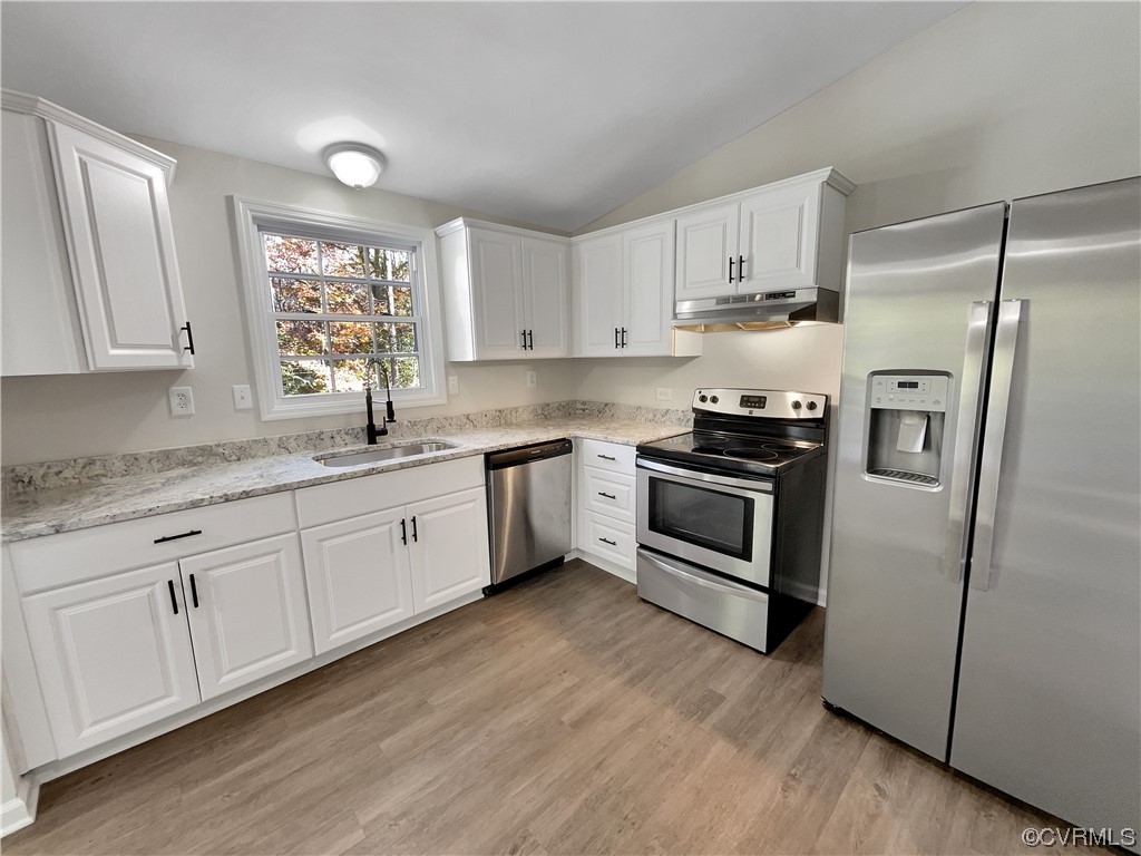 1125 Oldbury Road Midlothian, VA 23113 - Photo 6 of 17 a kitchen with granite countertop white cabinets and white appliances