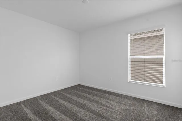 a view of a room that has a window in it