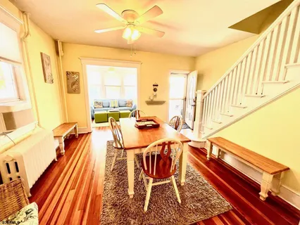 a dinning room with a table and chairs
