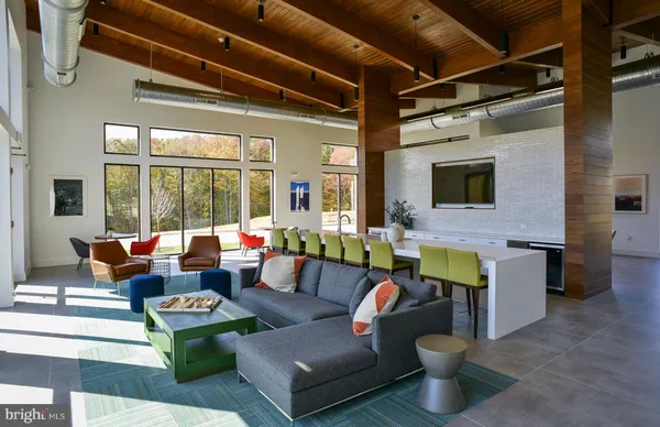a living room with fireplace furniture and a flat screen tv
