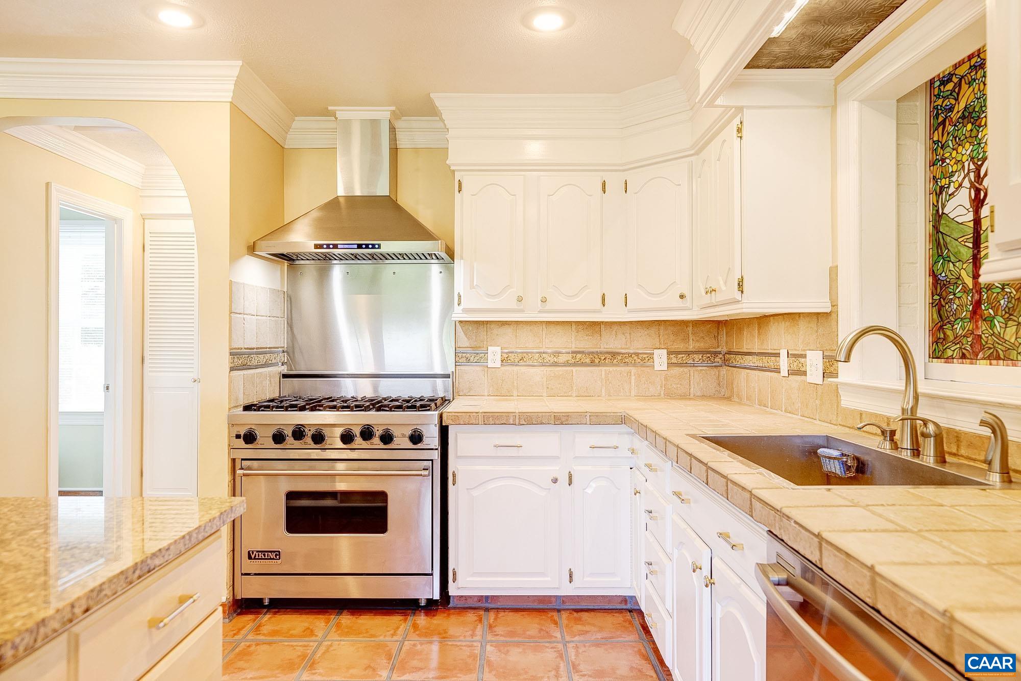843 Campbell Road Keswick, VA 22947 - Photo 13 of 46 a kitchen with a stove a sink and a refrigerator
