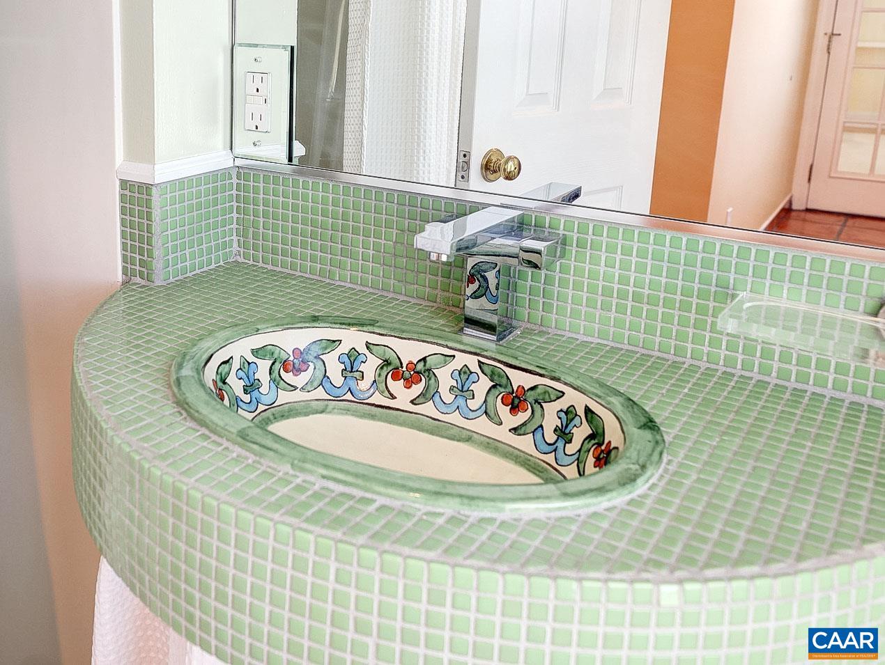 843 Campbell Road Keswick, VA 22947 - Photo 16 of 46 a bathroom with a sink and a mirror