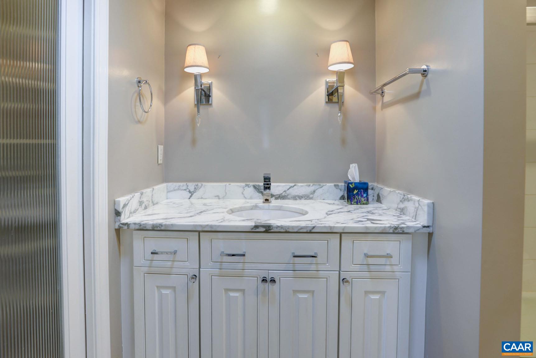 843 Campbell Road Keswick, VA 22947 - Photo 20 of 46 a bathroom with a granite countertop sink and a mirror