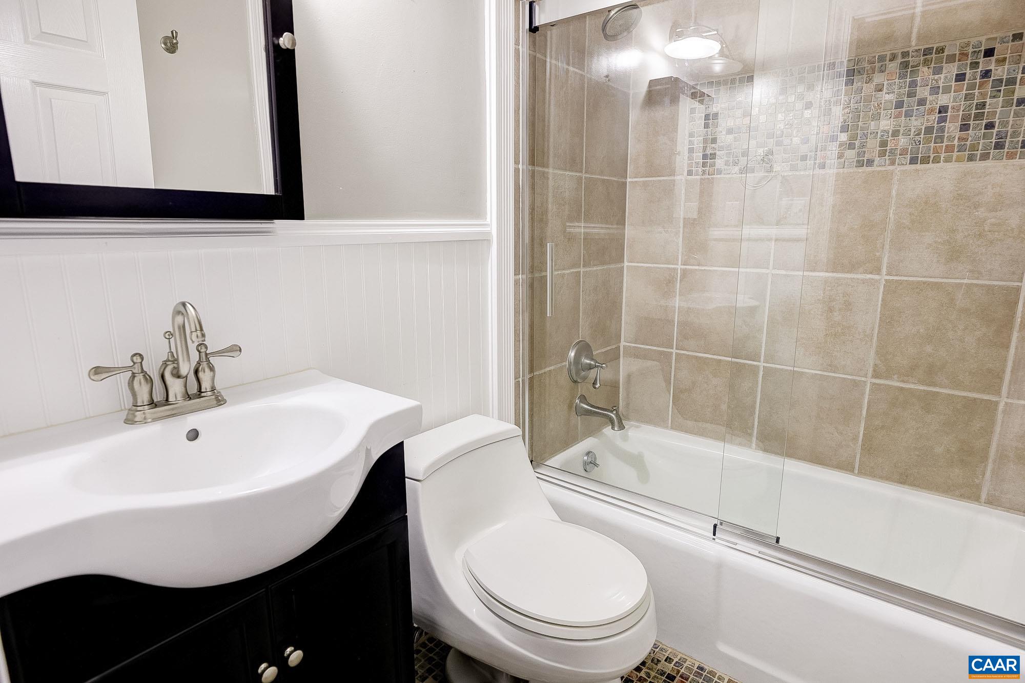 843 Campbell Road Keswick, VA 22947 - Photo 28 of 46 a bathroom with a sink toilet and shower