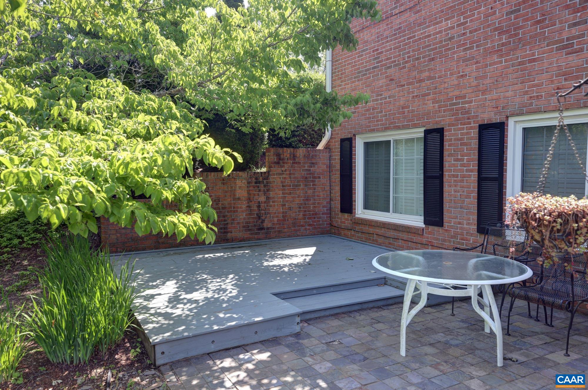 843 Campbell Road Keswick, VA 22947 - Photo 36 of 46 a view of a patio with table and chairs and potted plants