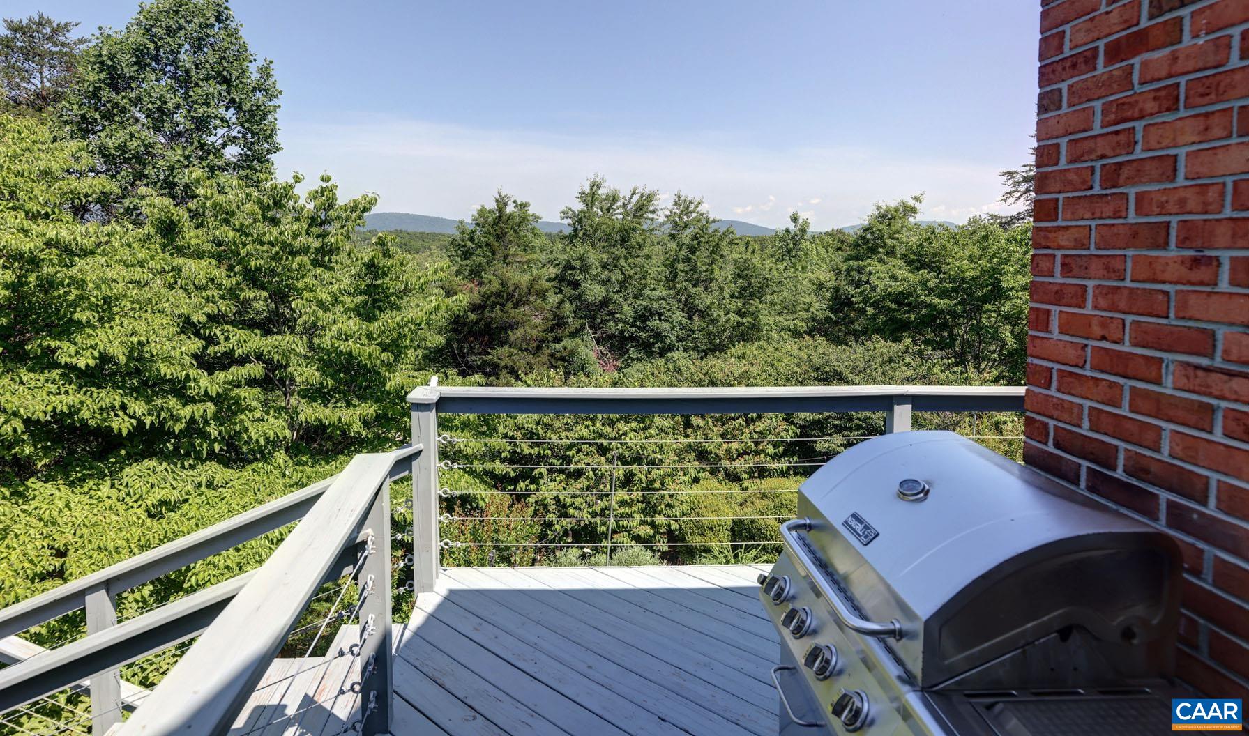 843 Campbell Road Keswick, VA 22947 - Photo 37 of 46 a balcony with wooden floor and fence