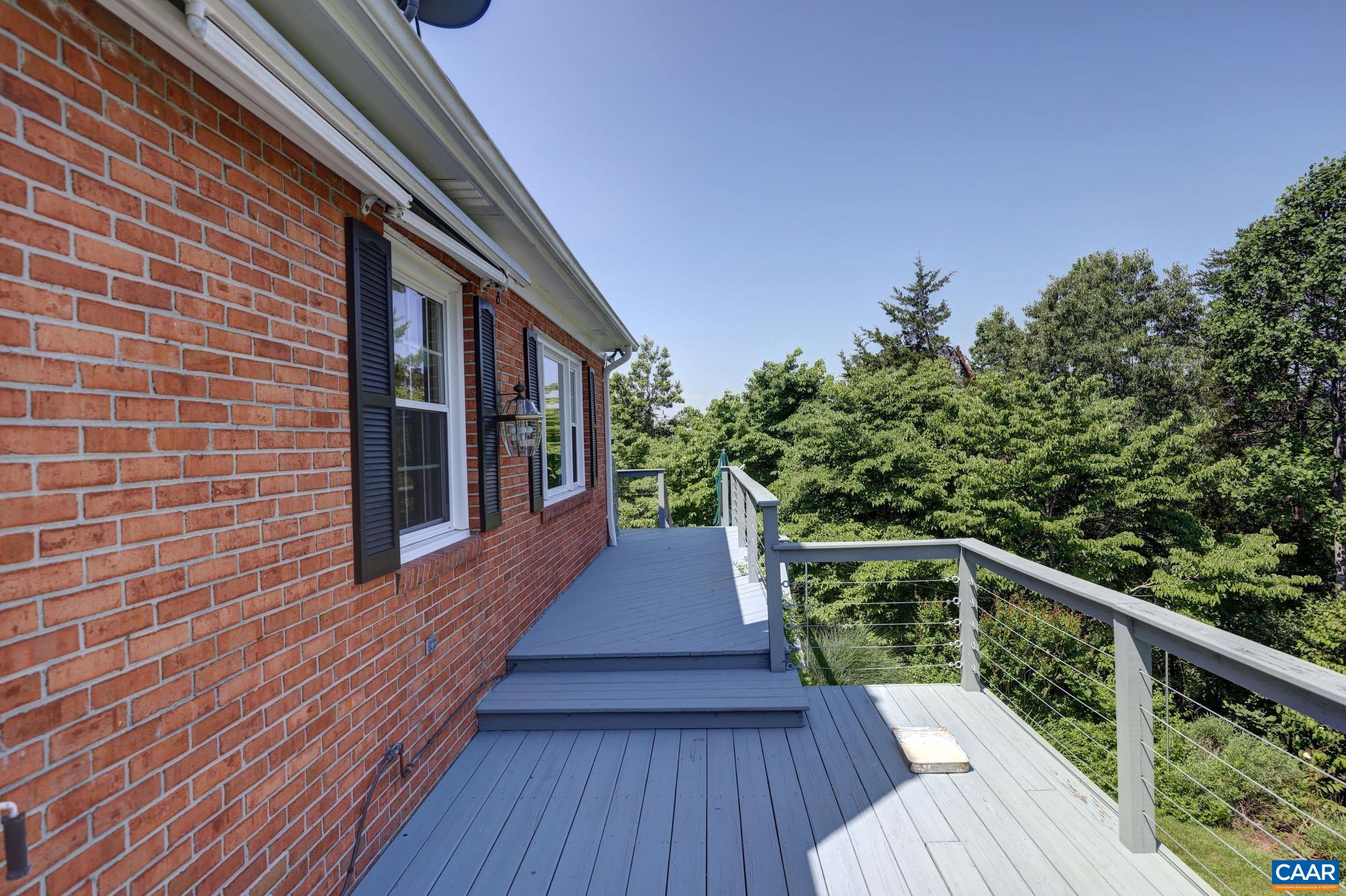 843 Campbell Road Keswick, VA 22947 - Photo 38 of 46 a balcony with wooden floor and outdoor space