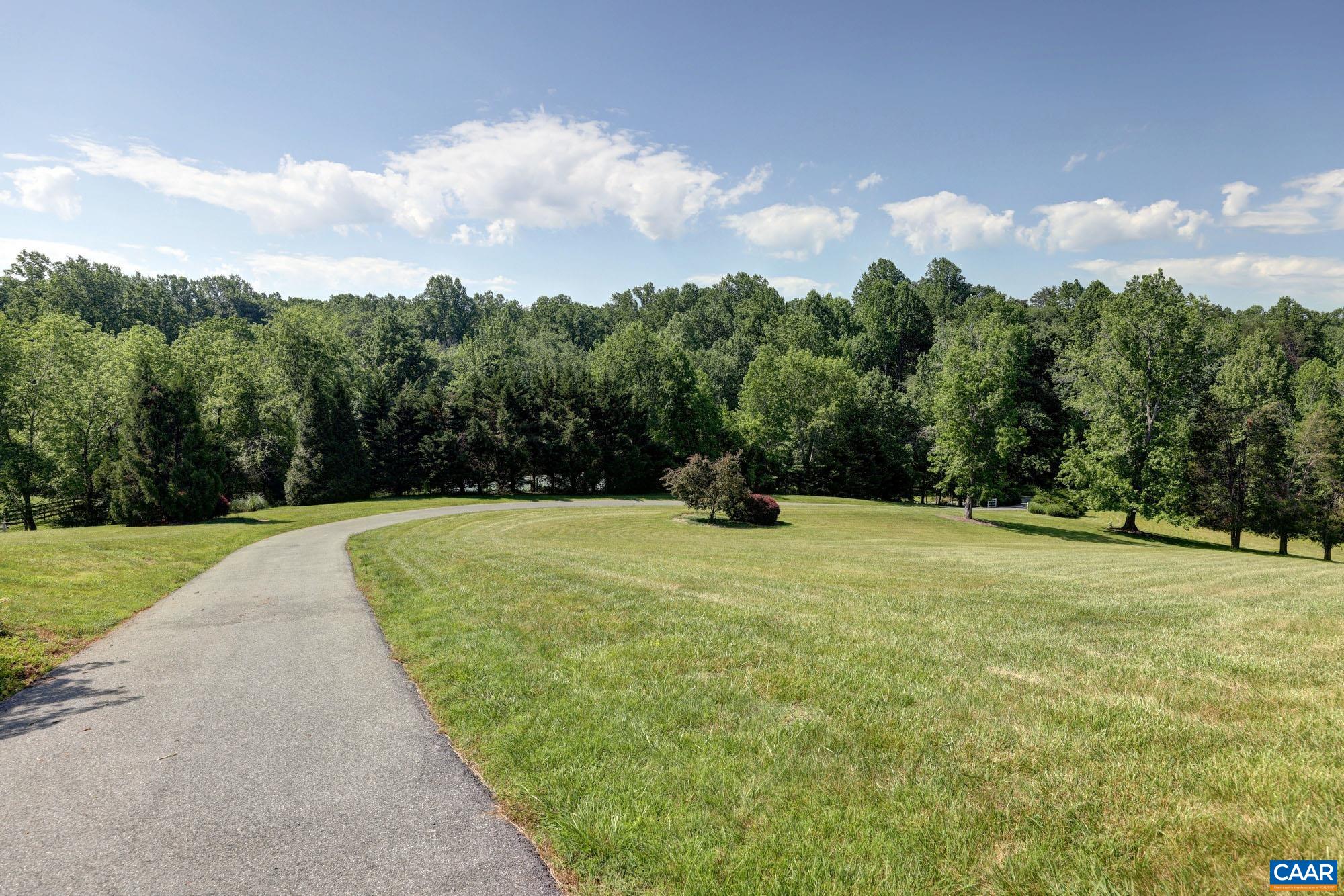 843 Campbell Road Keswick, VA 22947 - Photo 44 of 46 a view of a yard with a trampoline