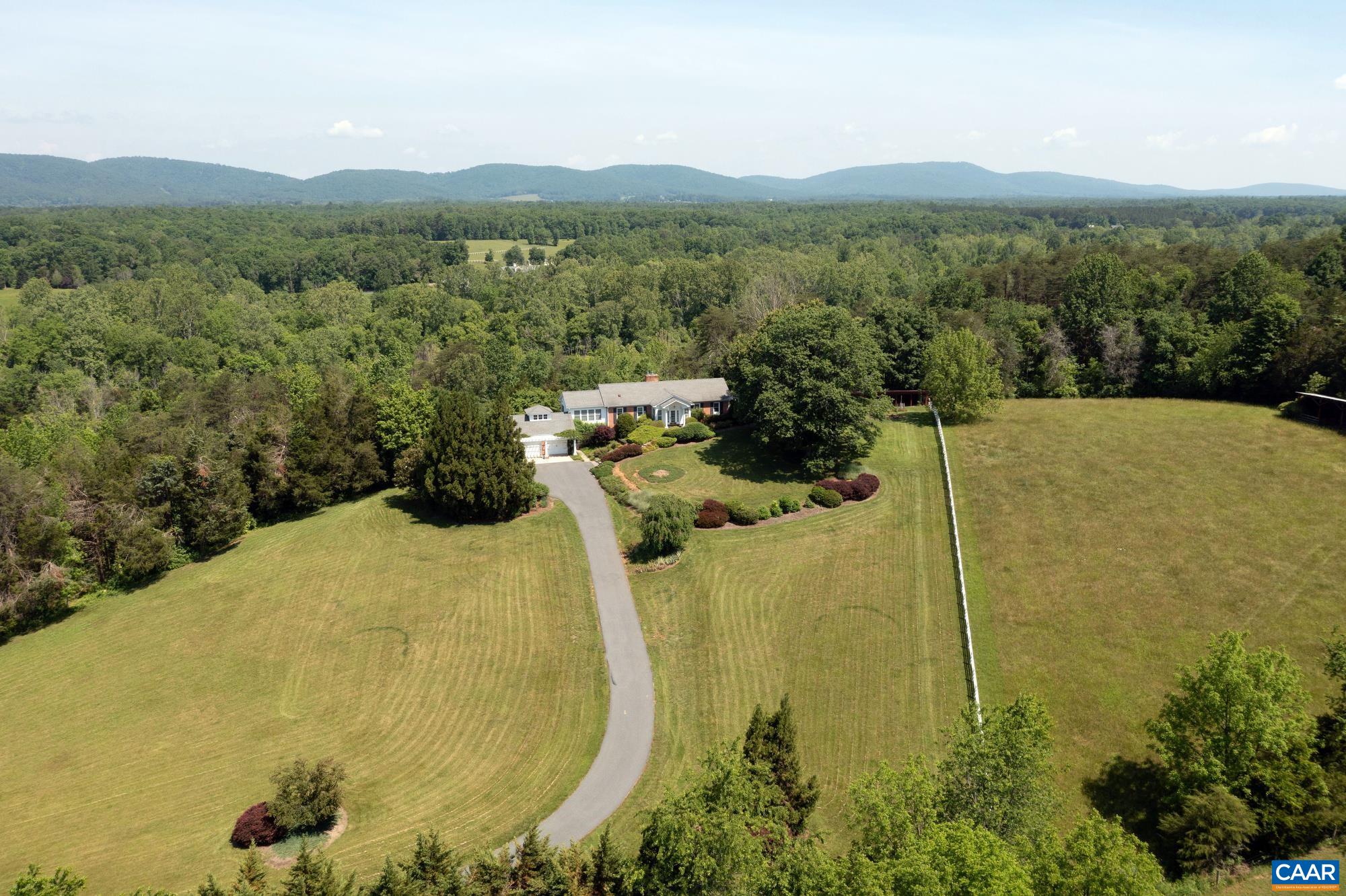 843 Campbell Road Keswick, VA 22947 - Photo 45 of 46 a view of a lake with a mountain