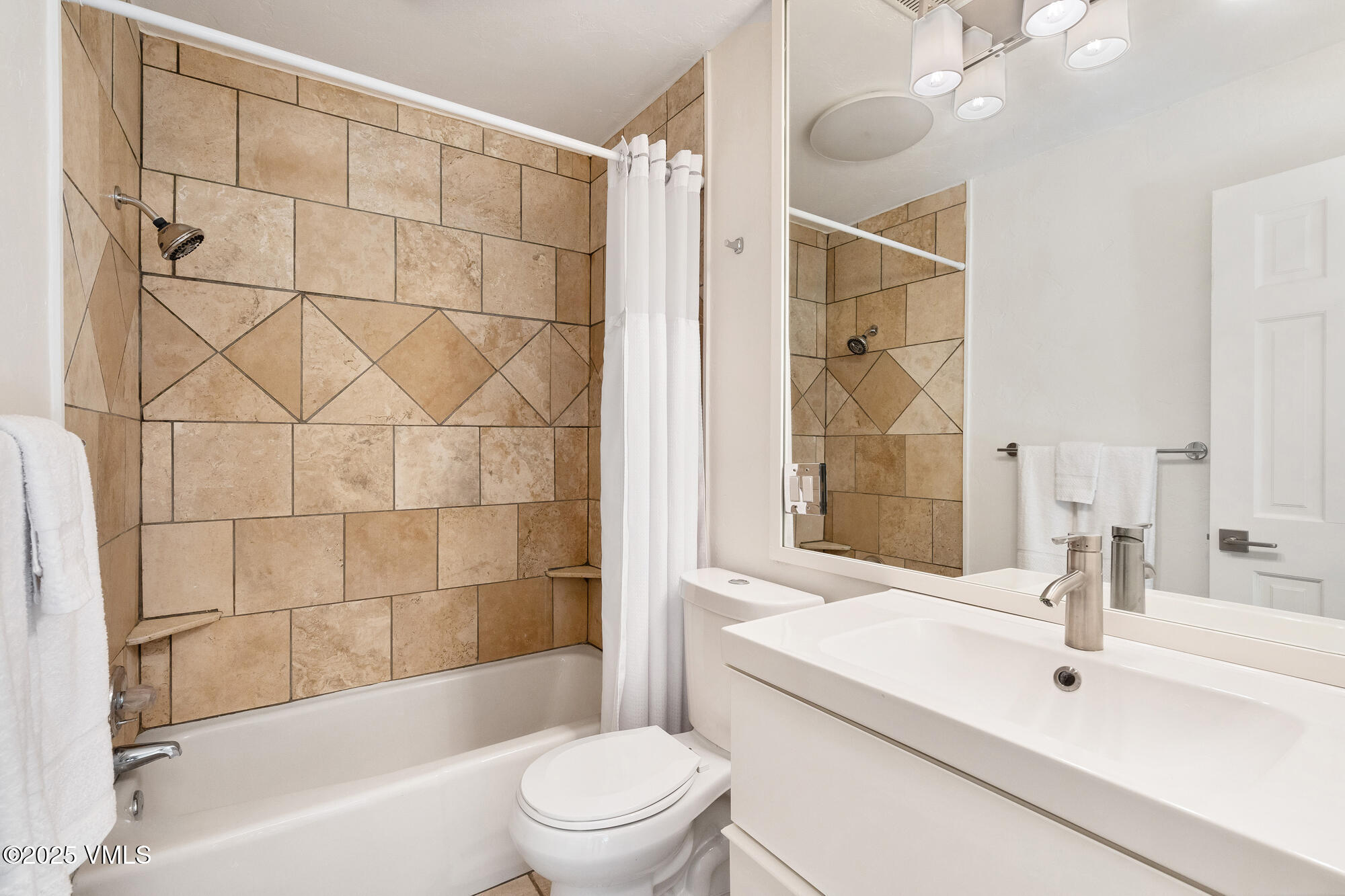 4545 Big Horn Road Vail, CO 81657 - Photo 41 of 49 a bathroom with a sink a toilet and shower