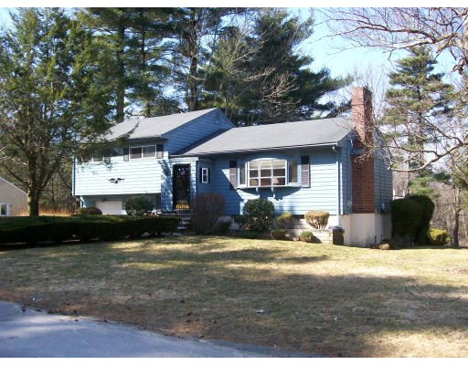 7 Shepard Way Canton, MA 02021 - Photo 1 of 1 a front view of a house with a yard and garage