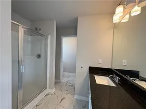 a bathroom with a bathtub and shower