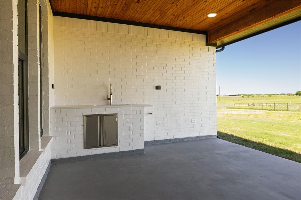 7196 Hawkeye Road Sanger, TX 76266 - Photo 4 of 26 View of patio with a rural view