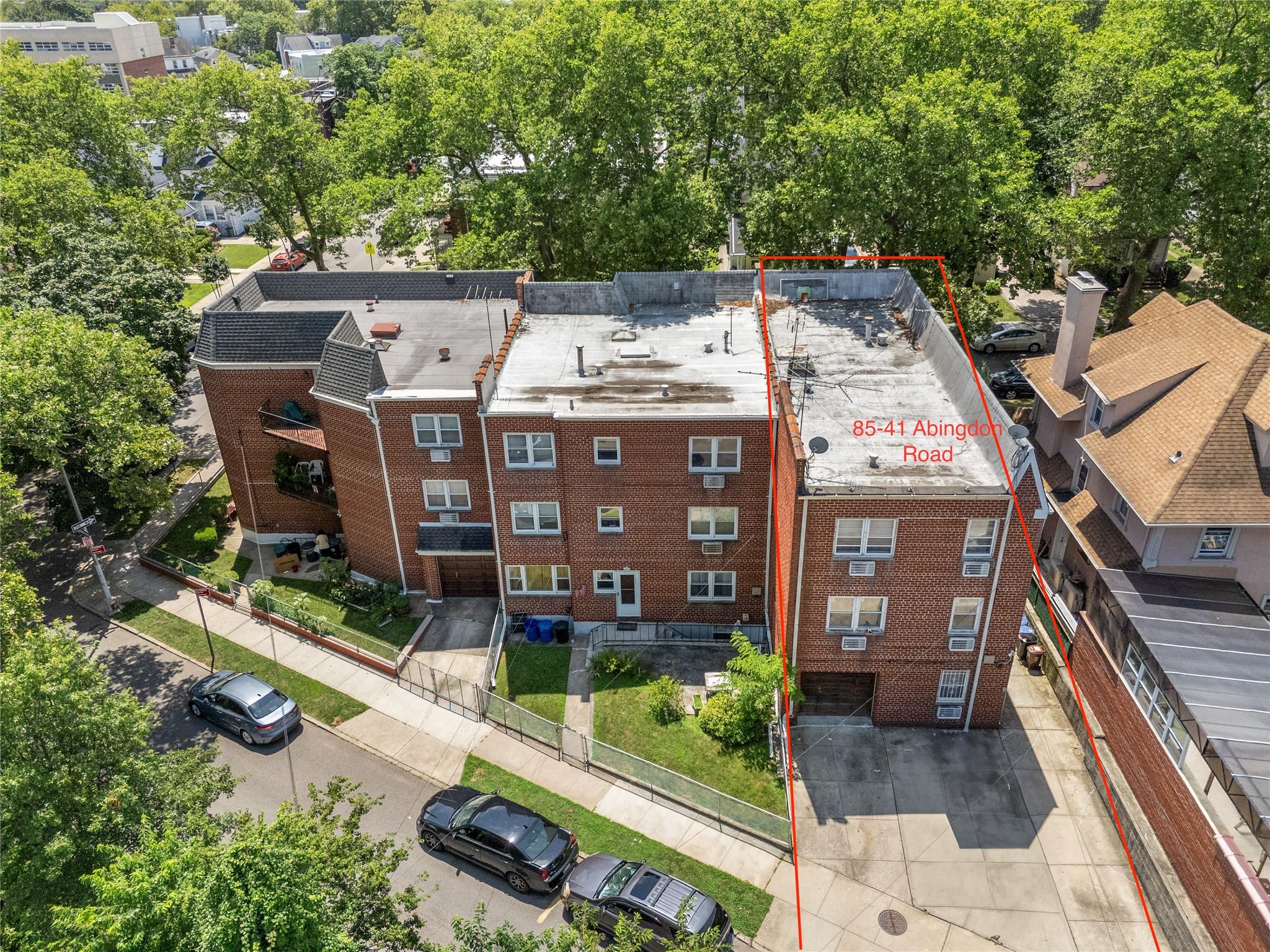 85-41 Abingdon Road Queens, NY 11415 - Photo 2 of 10 an aerial view of a house with a yard