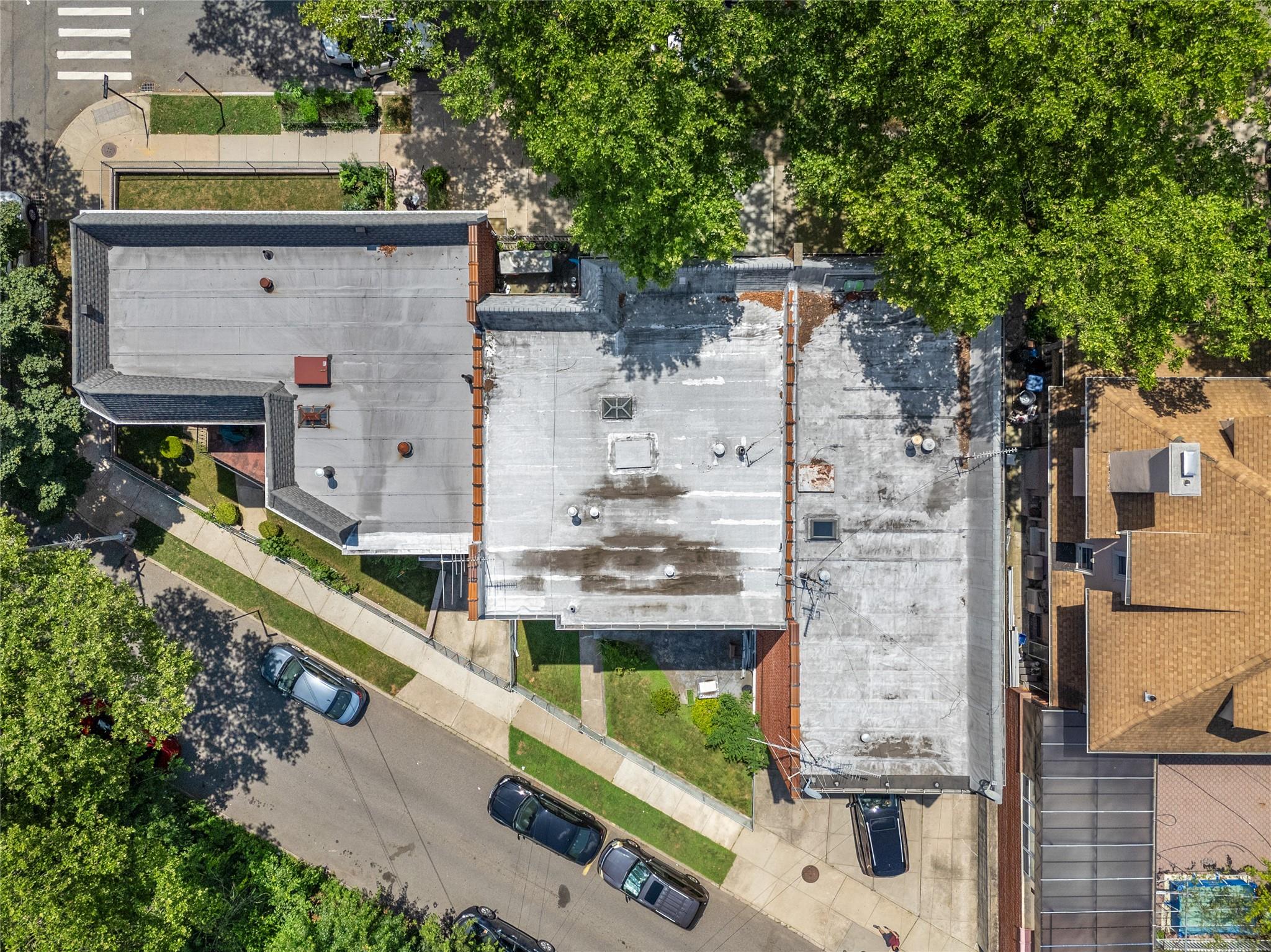 85-41 Abingdon Road Queens, NY 11415 - Photo 3 of 10 an aerial view of a house with a garden
