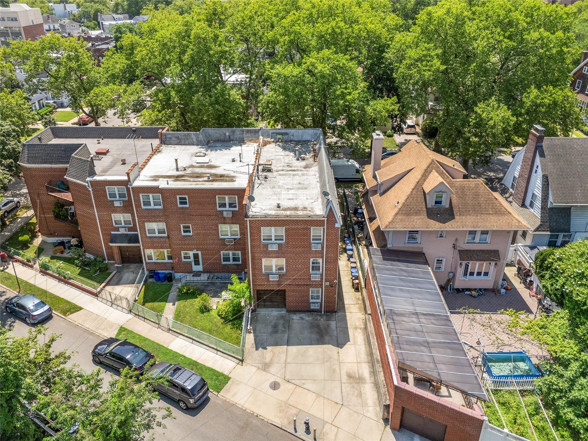 85-41 Abingdon Road Queens, NY 11415 - Photo 4 of 10 an aerial view of a house with a garden