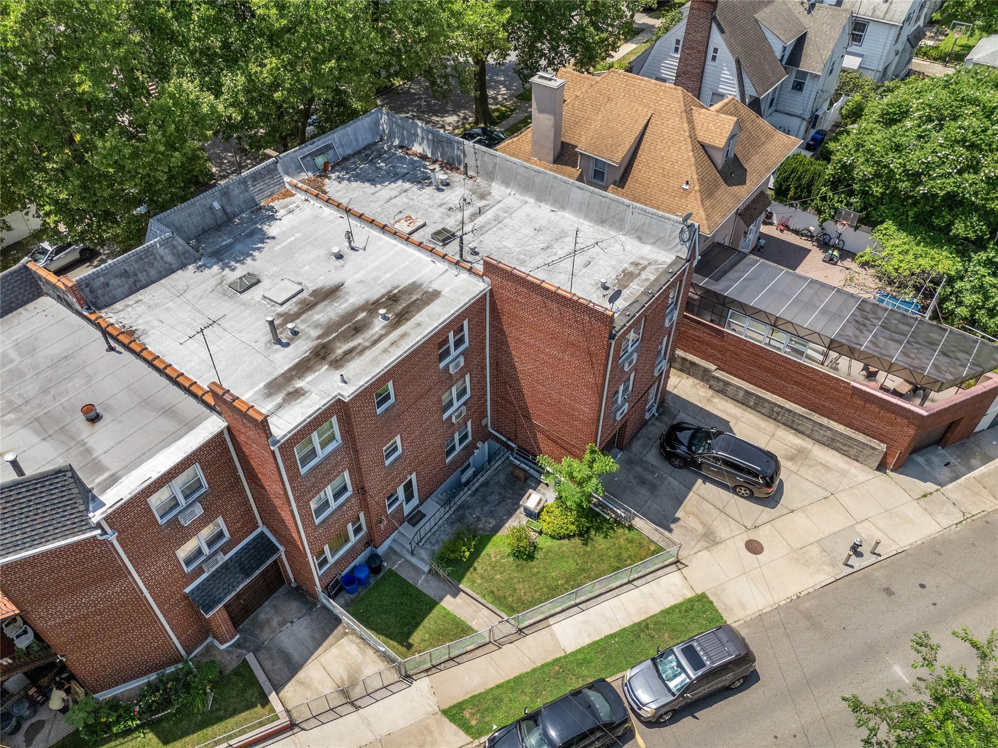 85-41 Abingdon Road Queens, NY 11415 - Photo 7 of 10 an aerial view of a house with a garden